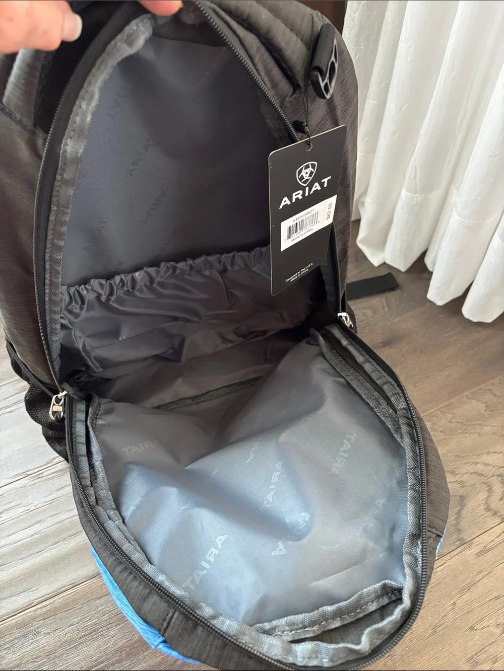 Ariat Logo Backpack,3 zipper compartments,organization slots,bottle holders